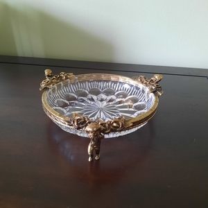 Gold tone 3 footed cherubs glass vanity bowl.